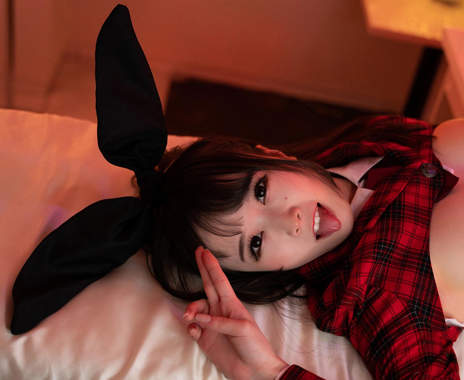 Ria Kurumi wears a Cosplay costume with Bunny ears, heart shaped pasties and a plaid jacket for Cospuri.